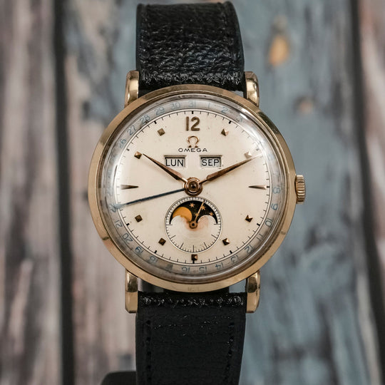 Omega Cosmic triple date or jaune 18K -1946-